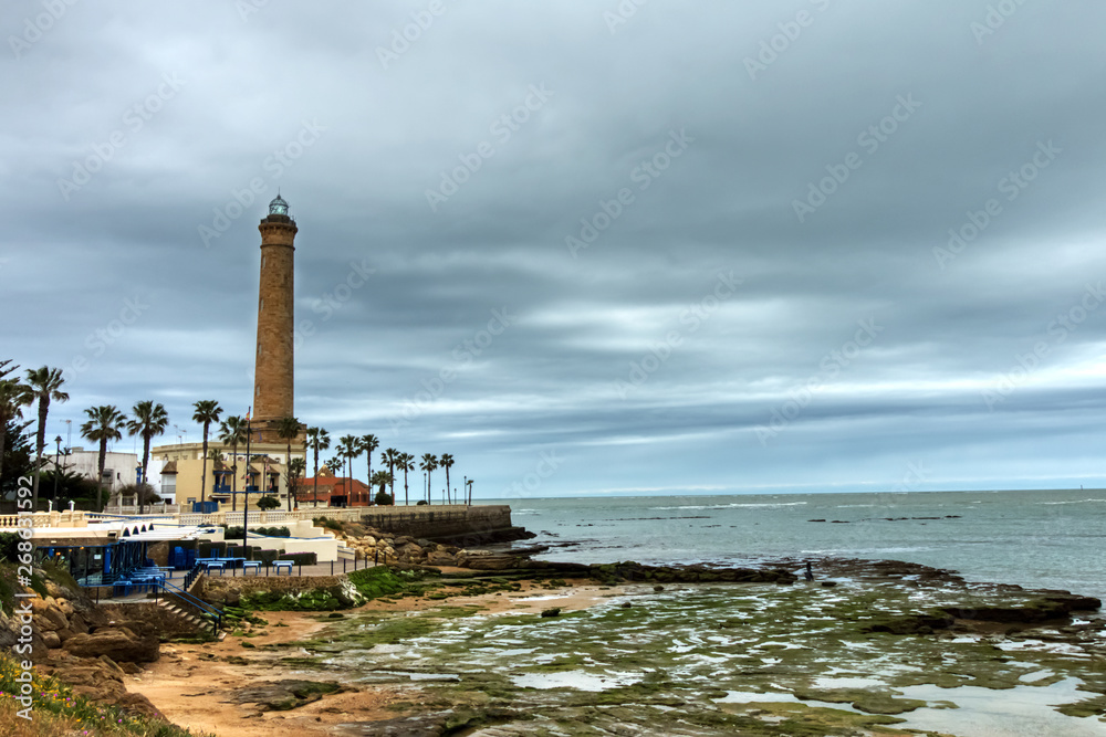 Chipiona beach, in the province of Cadiz, Spain, with the lighthouse in the background on a winter day