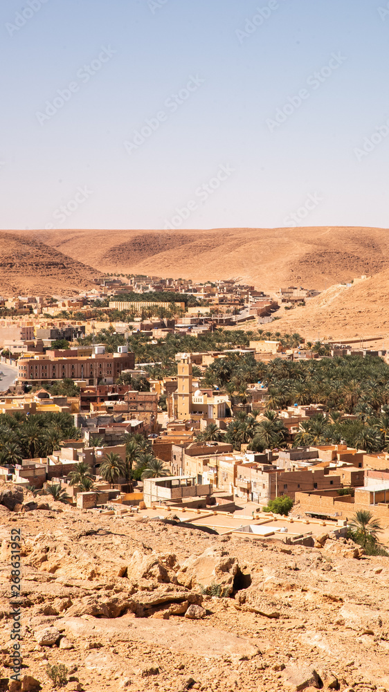 Beautiful panorama skyline view of Bou Saada surrounded by desert from above in Algeria