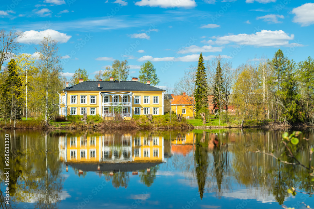 Kouvola, Finland - May 16, 2019: Beautiful wooden Rabbelugn Manor - Takamaan Kartano. Wrede family house was built in 1820 on the river Kymijoki bank.