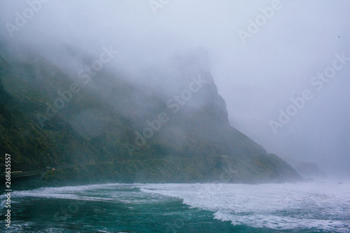 Waves of a raging dark sea crashing on rocks © sipcrew