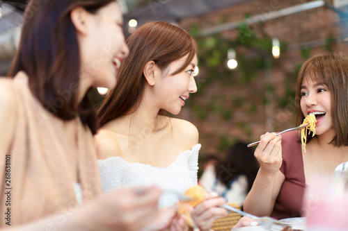 Group of Happy friends having dinner in the restaurant