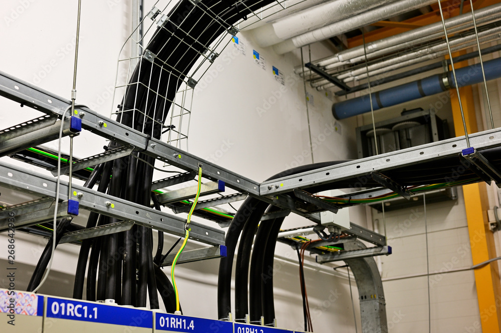 Naklejka premium Cables placed on the cable rack in the interior.