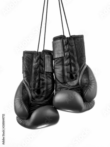 boxing gloves hanging on the wall, close-up. © Lumppini