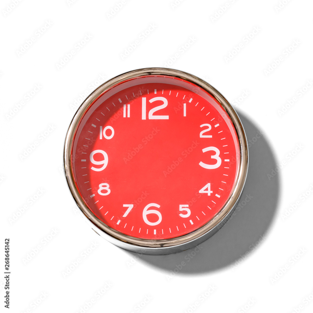 Red clock without hands with large white numbers on a white background. Red clock without hands with large white numbers on a white background.