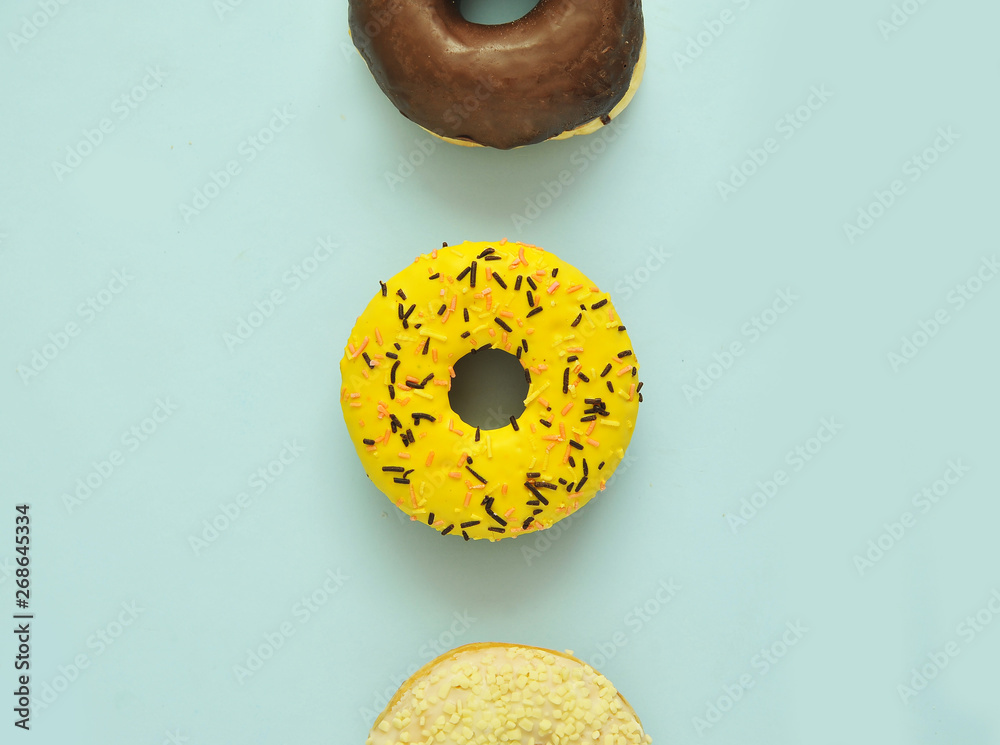 Wunschmotiv: Delicious donuts on light pastel color background. National Donut Day concept. #2686453