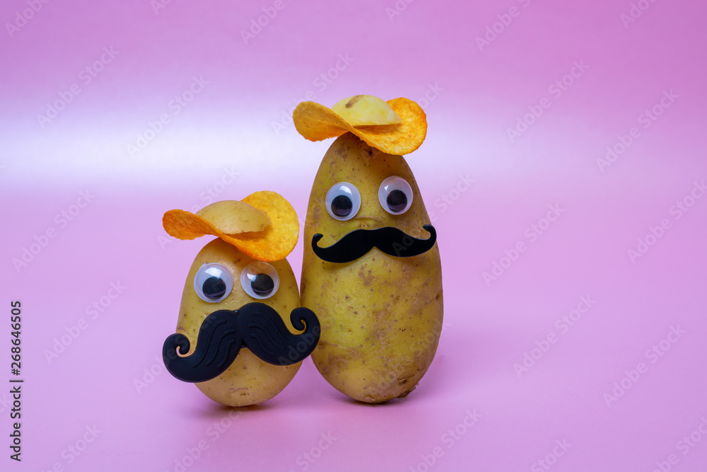 funny potato head with face on pink background