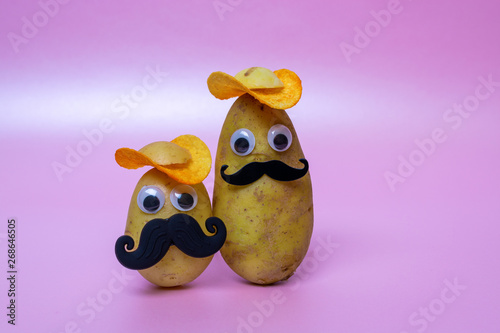 Obraz na płótnie funny potato head with face on pink background w salonie