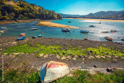 Boats in the bay at low tide. Urdaibai, Biscay, Spain photo