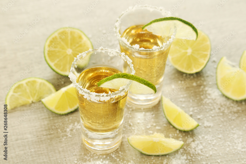 Tequila shots with sliced lime	