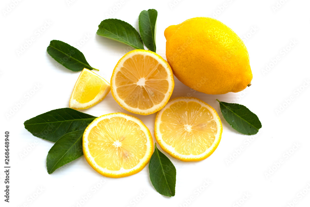 Fototapeta premium lemon with lime and leaves isolated on white background