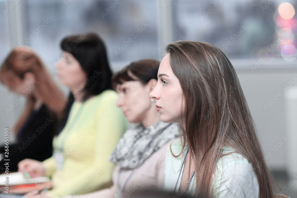 business woman on the background of colleagues in the conference room business woman on the background of colleagues in the conference room