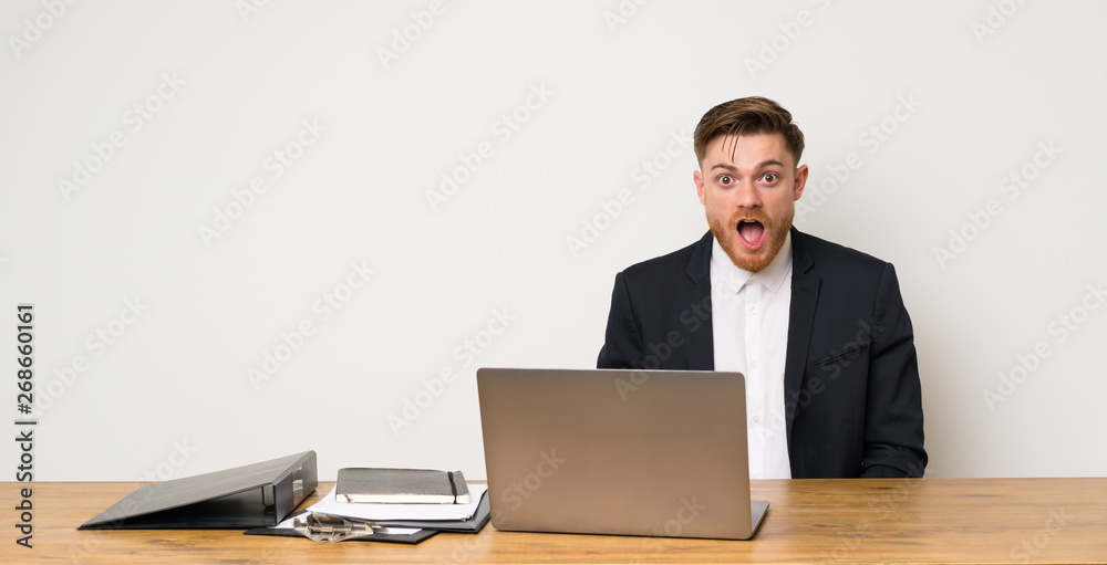 Businessman in a office with surprise facial expression Businessman in a office with surprise facial expression