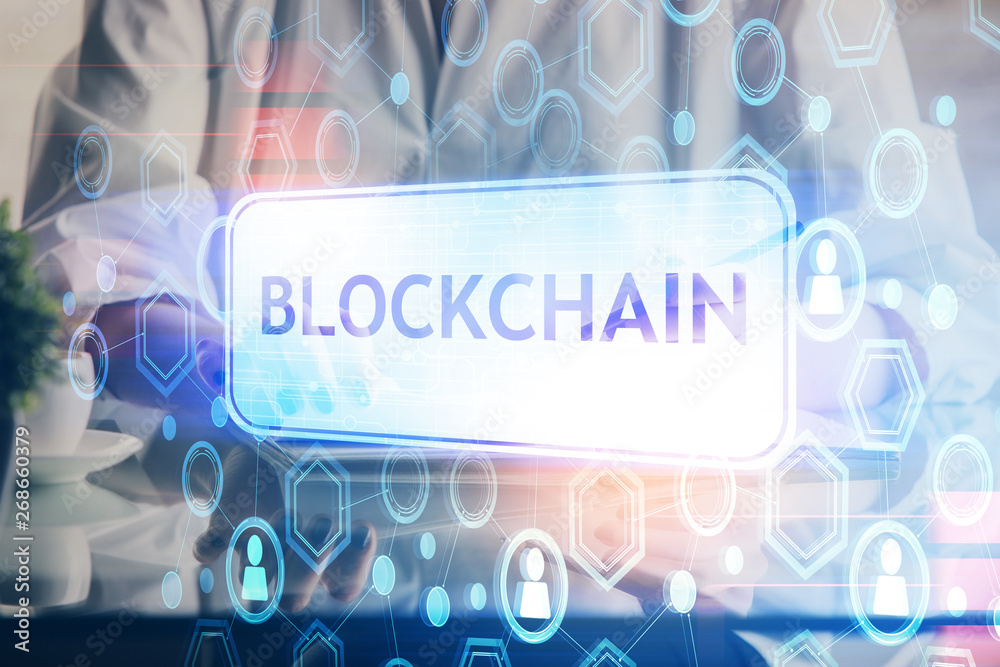 Cryptocurrency hologram, bitcoin, ico theme over hands taking notes background. Concept of blockchain. Multi exposure Cryptocurrency hologram, bitcoin, ico theme over hands taking notes background. Concept of blockchain. Multi exposure