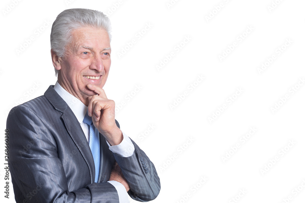 Senior businessman wearing suit wit hand on chin isolated on white background Senior businessman wearing suit wit hand on chin isolated on white background