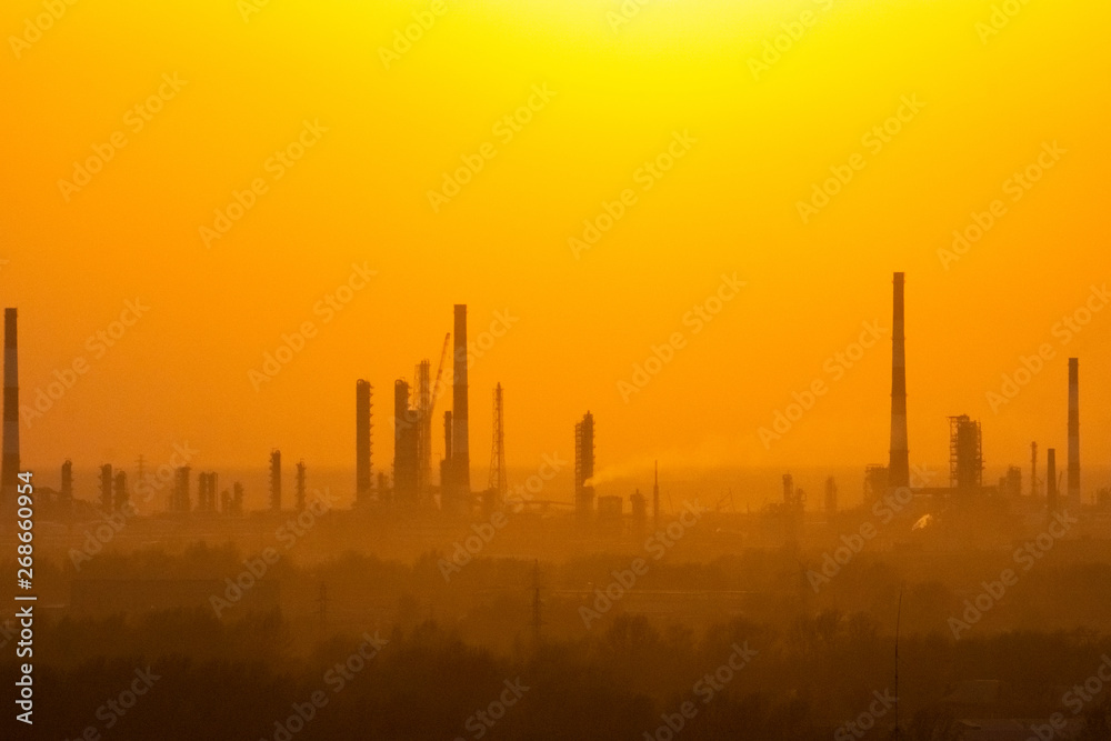 Obraz premium sunset over industrial areas with factories