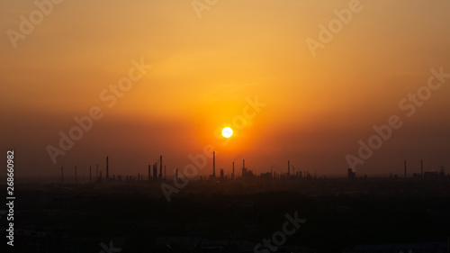 sunset over industrial areas with factories