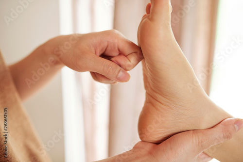 Process of reflexology treatment photo