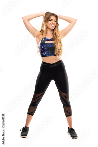 Blonde Sport Woman over isolated white background © luismolinero