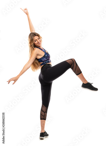 Ballerina dancing over isolated white background