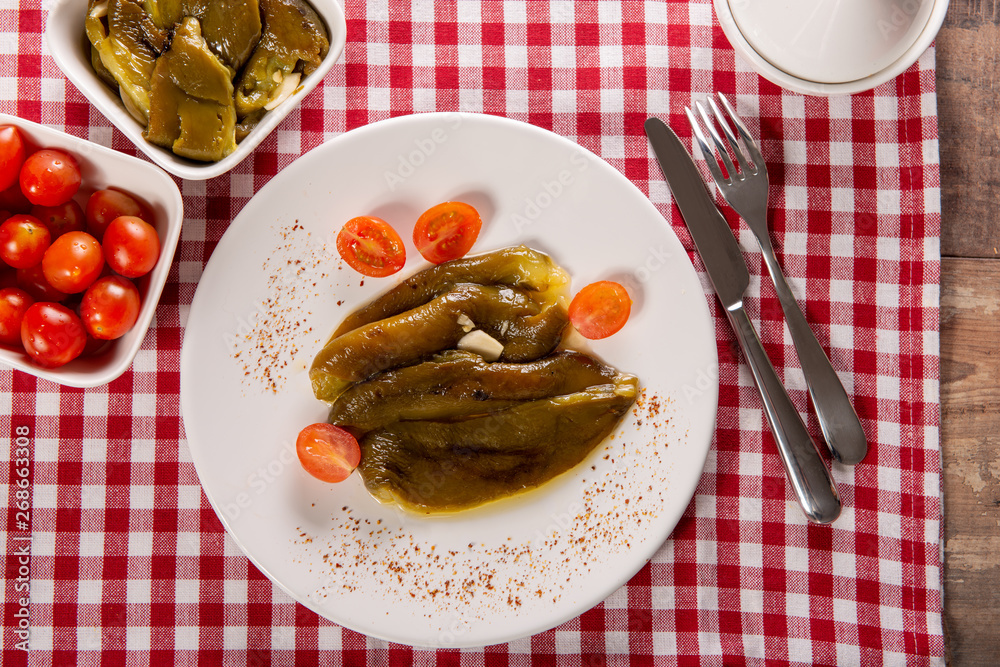 plate of green bell peppers with olive oil