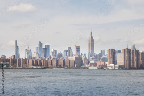 View of Manhattan buildings and river from Brooklyn neighborhood in New York.