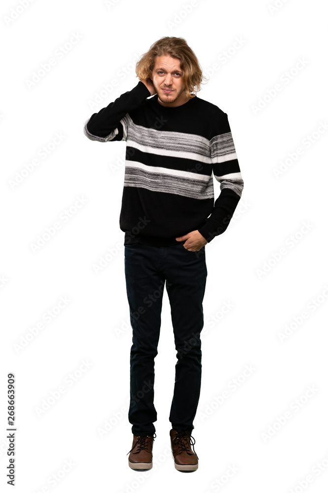 Full-length shot of Blonde man having doubts over isolated white background Full-length shot of Blonde man having doubts over isolated white background