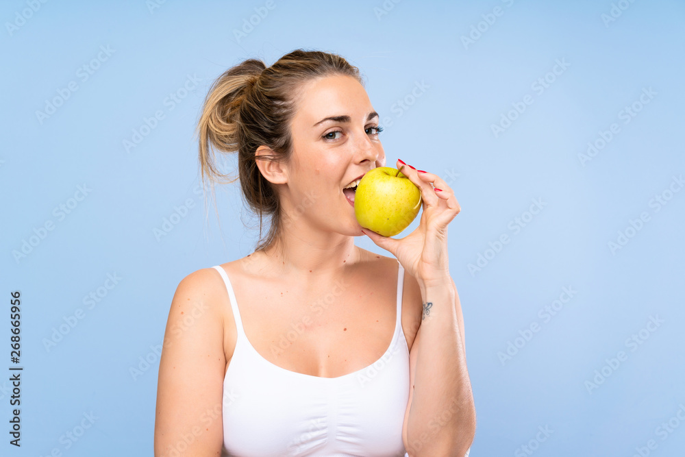 Young blonde woman with an apple Young blonde woman with an apple