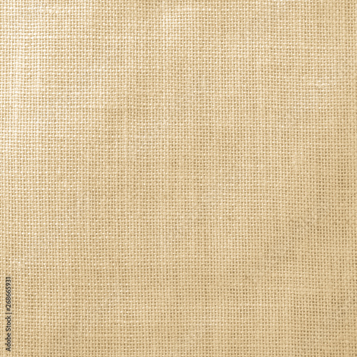 Hessian sackcloth woven texture pattern background in light yellow gold brown color tone