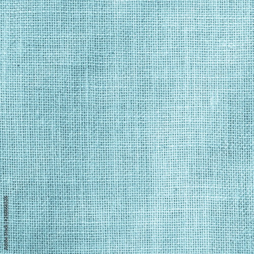 Hessian sackcloth woven texture pattern background in light aqua blue cyan turquoise green color tone