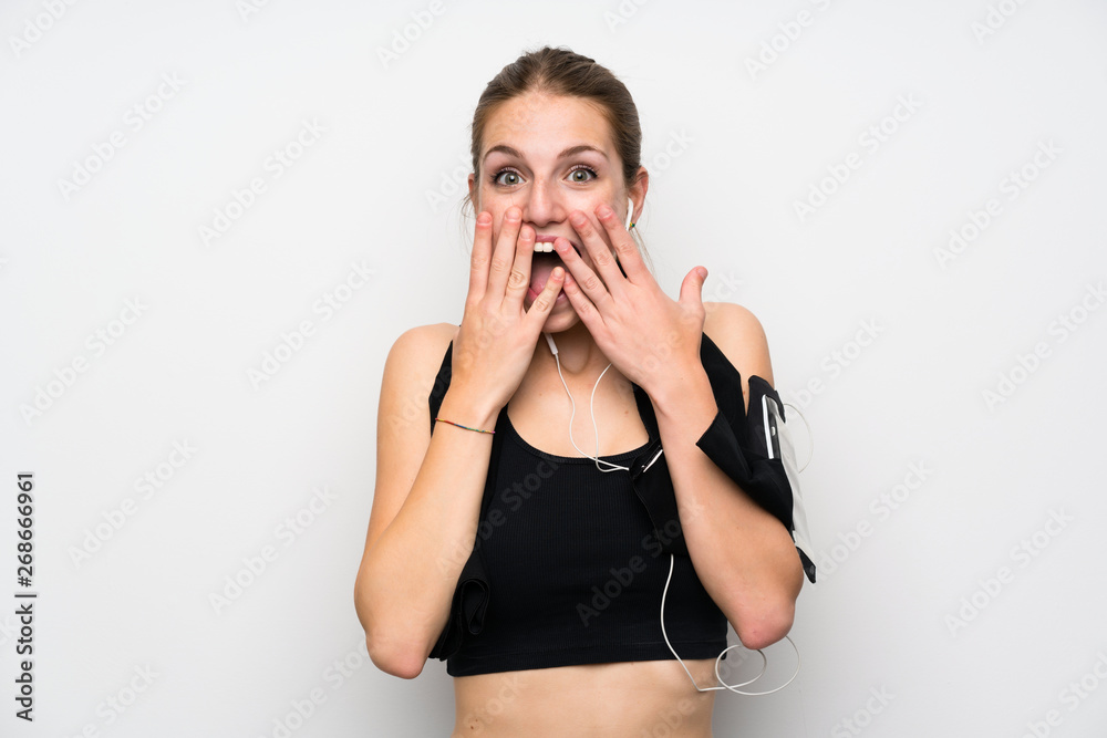 Young sport woman over isolated white background with surprise facial expression Young sport woman over isolated white background with surprise facial expression