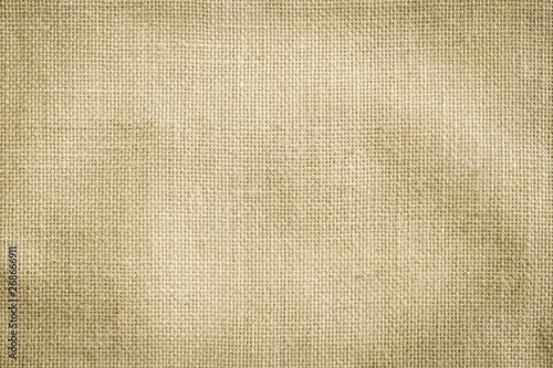 Hessian sackcloth woven texture pattern background in yellow beige cream brown color