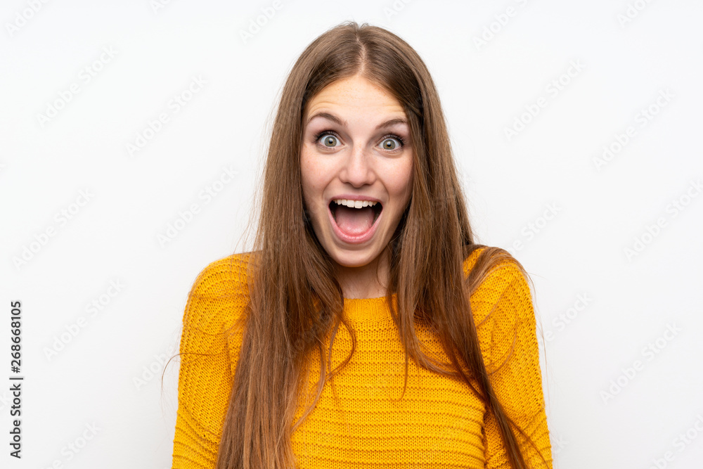 Young woman with yellow over isolated white wall with surprise facial expression Young woman with yellow over isolated white wall with surprise facial expression