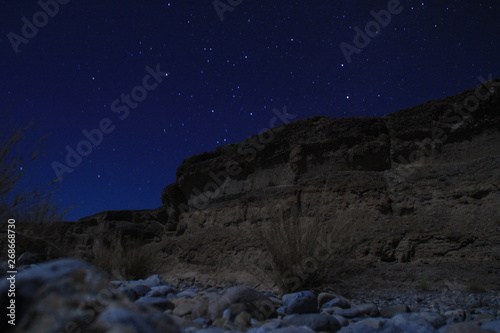 Sesriem Canyon  a natural gorge carved by the powerful Tsauchab River millions of years ago. Night landscape of the canyon with stars.