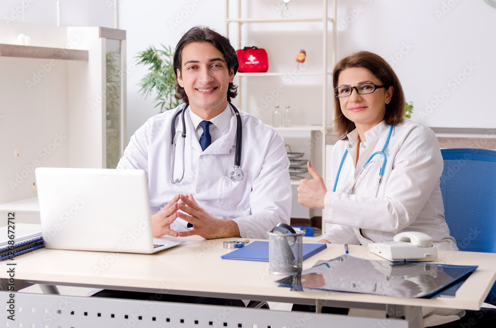 Two doctors working in the clinic Two doctors working in the clinic