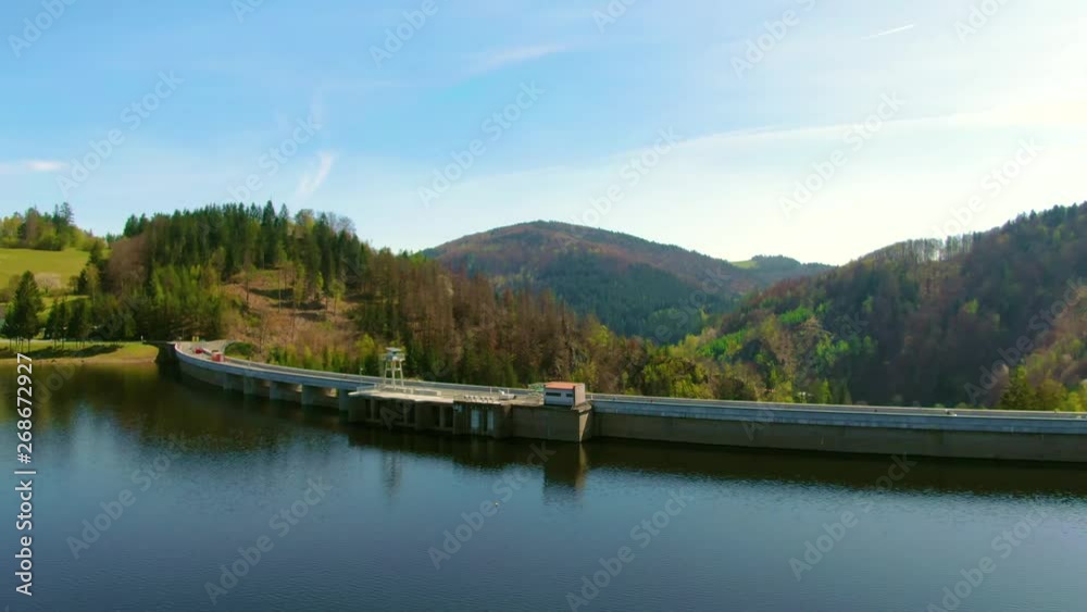 Aerial view of the dam reservoir with water power plant near lake. Aerial view of the dam reservoir with water power plant near lake.