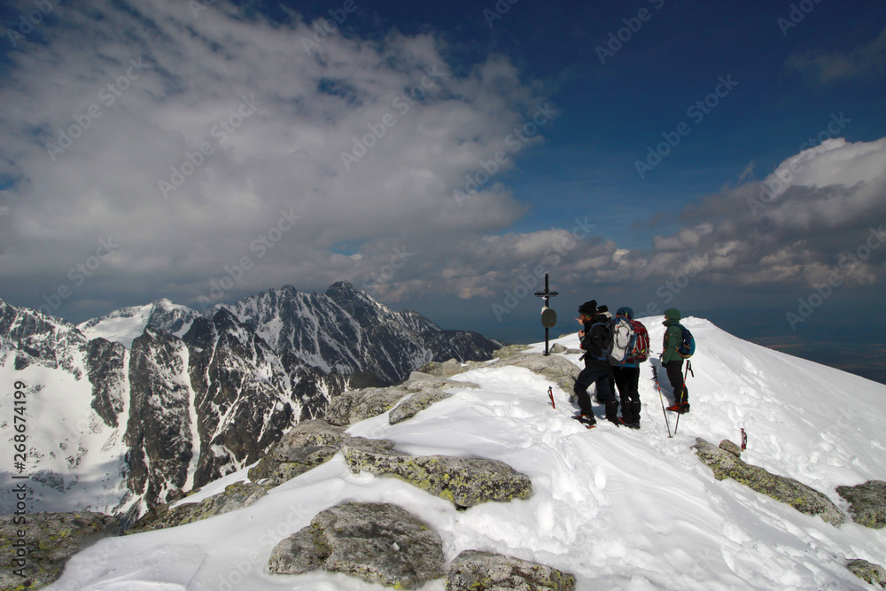 Mountaneers on the summit of Slavkovsky stit, Tatra Mountains, Slovakia