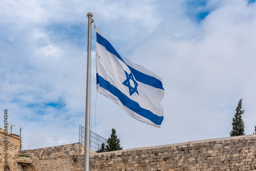 Israel, Jerusalem - 31 December 2018: Israeli flag at the Western wall