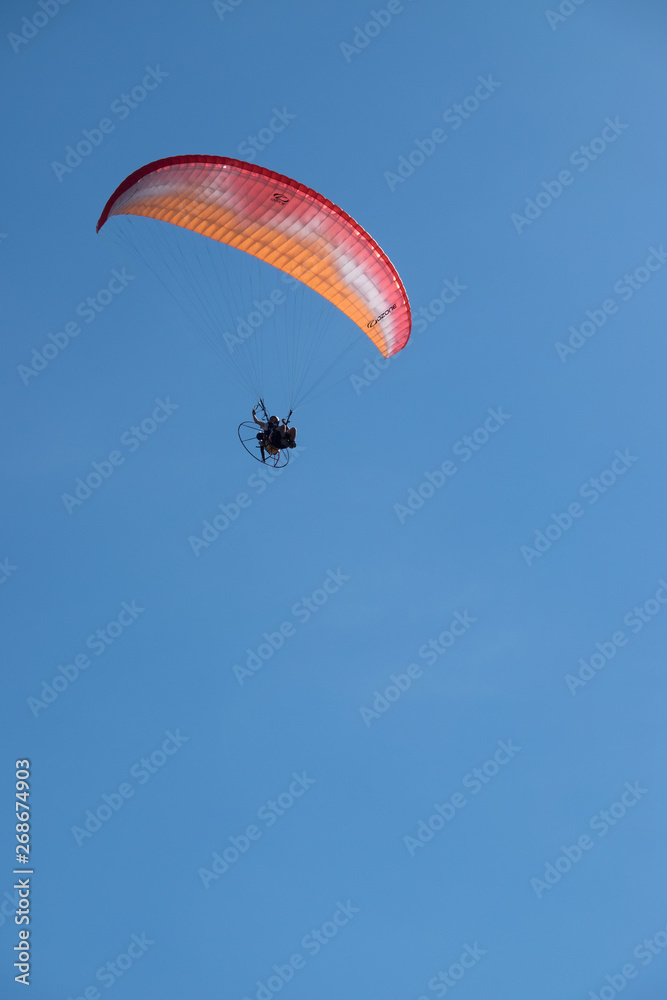 Parasailing over Las Flores Beach, on a very hot day during the summer at Maldonado, Uruguay. Parasailing over Las Flores Beach, on a very hot day during the summer at Maldonado, Uruguay.