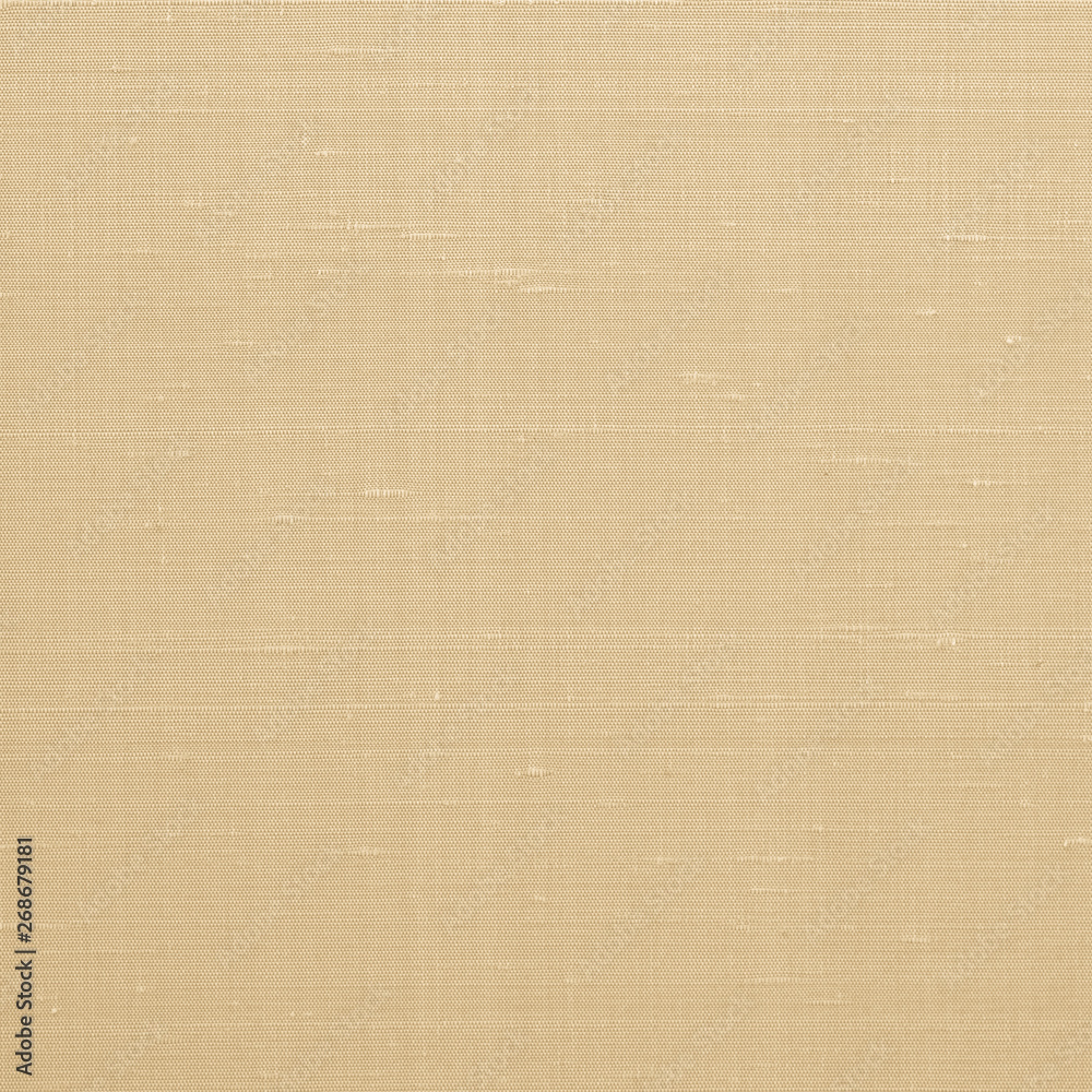 Fine natural cotton silk fabric wallpaper texture pattern background in light old yellow gold color tone Fine natural cotton silk fabric wallpaper texture pattern background in light old yellow gold color tone