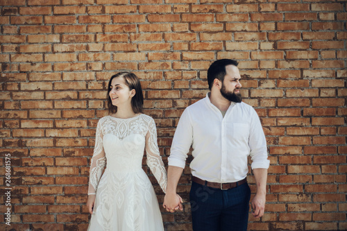 Happy to be together. Lovely wedding tourist couple walking on the city street.  © Alexander