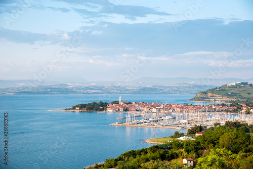 Beautiful amazing city scenery with boats in the bay in Izola, Slovenia. Wonderful exciting places. (vacation, rest - concept)