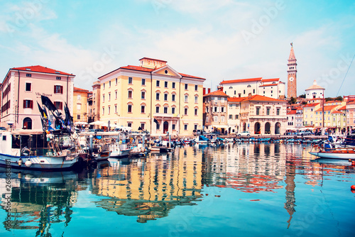 Beautiful amazing city scenery on the waterfront with boats in Piran, the tourist center of Slovenia. popular tourist attraction. Wonderful exciting places. © anko_ter