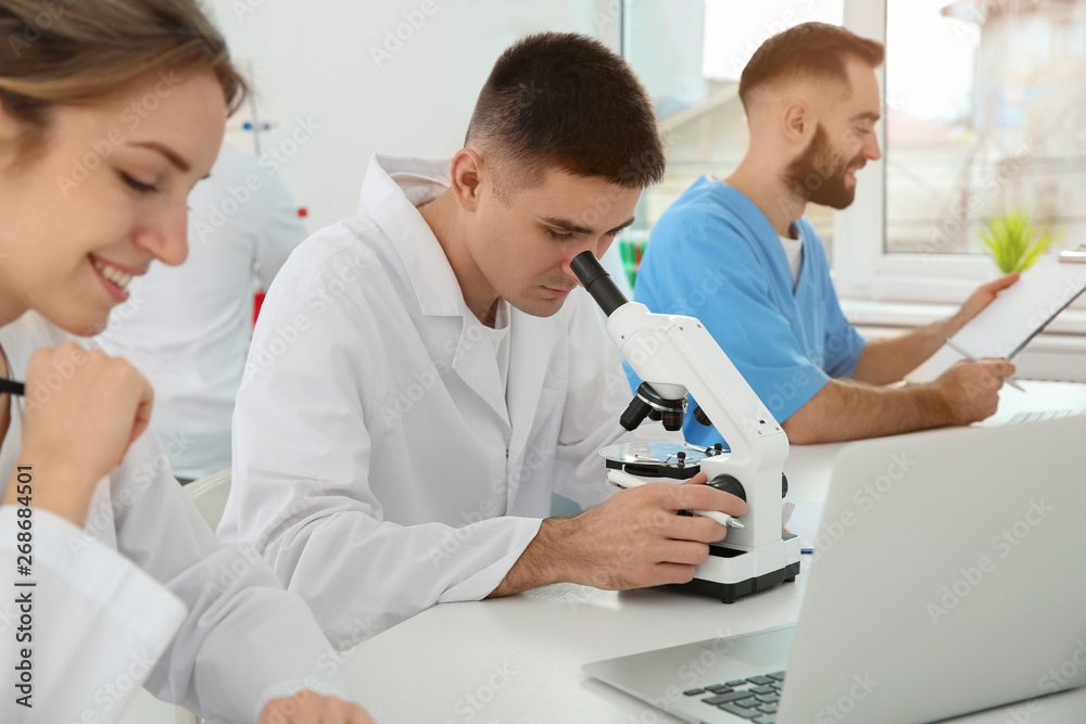 Medical students working in modern scientific laboratory