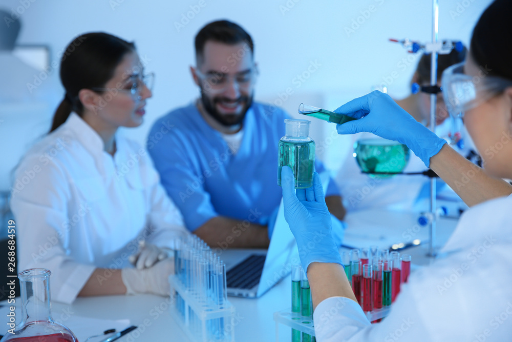 Fototapeta premium Medical students working in modern scientific laboratory