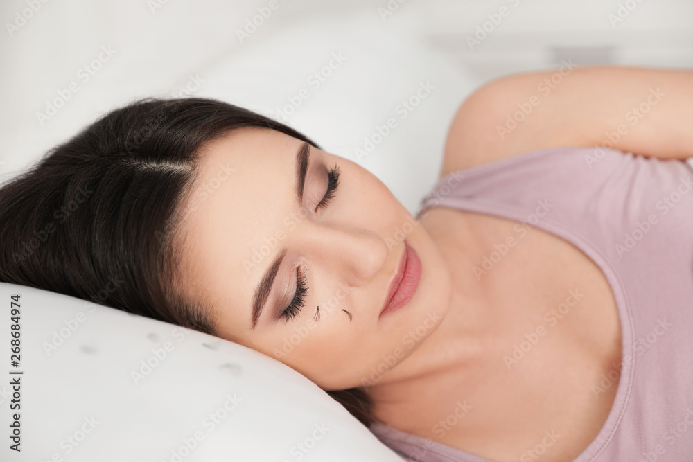 Young woman with eyelash loss problem sleeping in bed Young woman with eyelash loss problem sleeping in bed