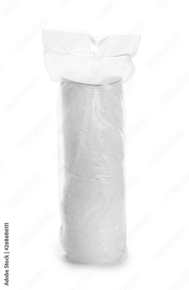 Cotton pads in plastic package on white background Cotton pads in plastic package on white background