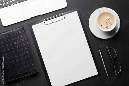 Office workplace table with blank paper page
