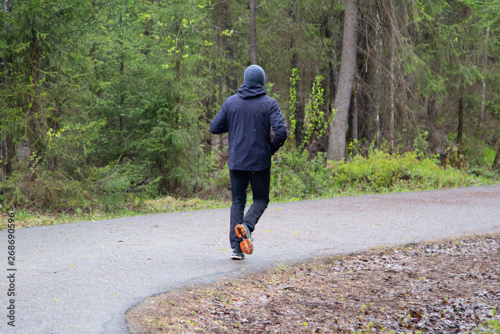 Fototapeta premium A man runs in the Park.