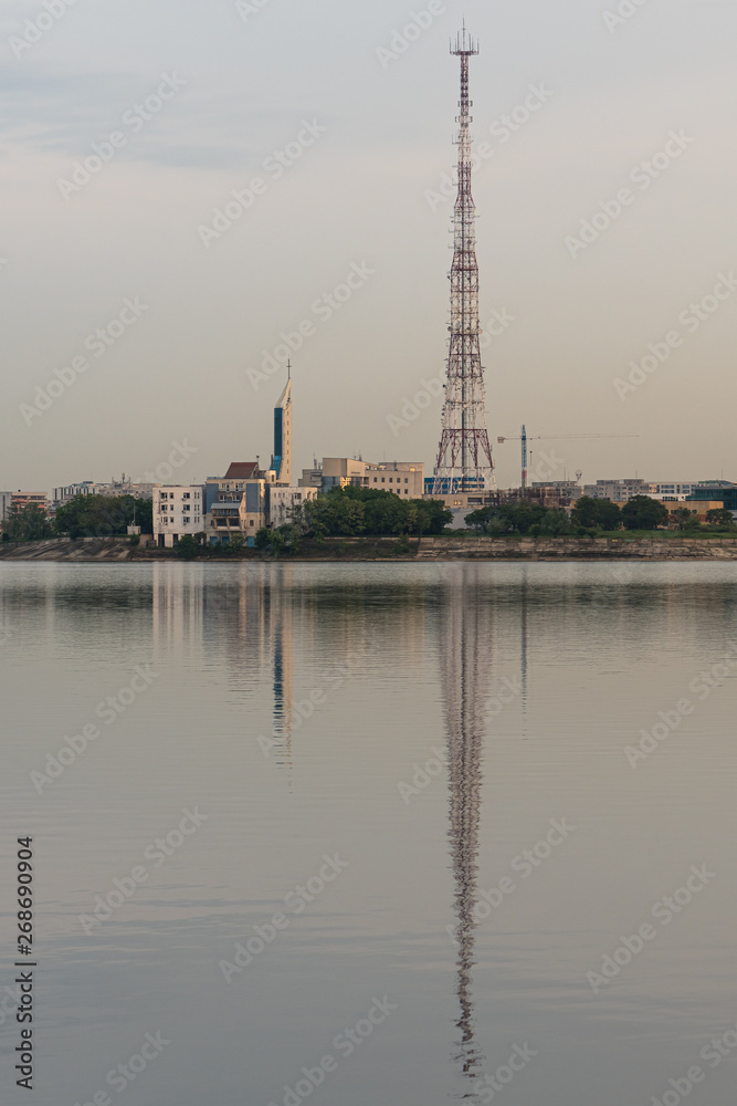 The Beautiful Symmetry of Two Towers Reflected into the Lake at Sunset