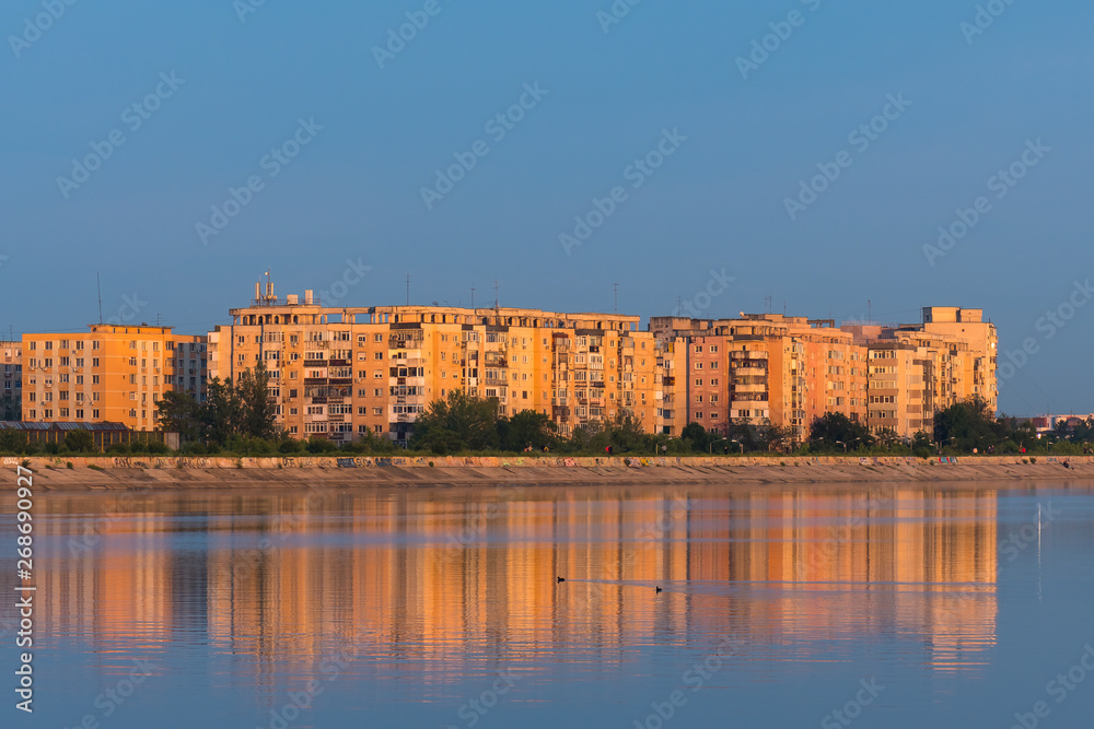 Buildings Lit by a Colorful Orange Sunset at the Lake